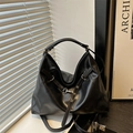 Versatile black faux leather tote bag with adjustable straps and glossy finish - Black