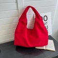 Large capacity red nylon shoulder bag with silver zipper closure for daily commute - Red