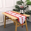 Chemin de table de Noël tricoté avec motifs rennes et pompons rouges pour décor de table - Style Traîneau de Renne
