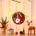 Detail of Christmas door hanger with Santa Claus motif and red plaid fabric texture - Red Santa Claus