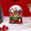 Close-up of Santa Claus snow globe with musical base and festive Christmas tree decor - Medium No Light - Style D