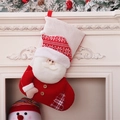 Knit Christmas stocking with 3D Santa Claus and plush cuff hanging on a fireplace - Santa Claus