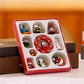 Wooden Christmas ornament gift set featuring painted figures and golden hanging strings - Doll Style