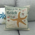 Detail of beach-themed square cushion with starfish print and cotton linen texture - Yellow Starfish Dance (8)