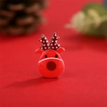 Macro shot of cute red resin reindeer DIY accessory with Christmas pine cone background - Christmas Red Reindeer (4)