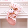 Pink Christmas stocking with 3D reindeer hanging on white fireplace festive decor - Deer