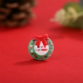 Close-up of a resin Christmas wreath flatback charm with Merry Christmas text on red background - Christmas Wreath Style (11)