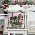 Detailed Christmas gnome pillow cover with Merry Everything text on a white chair - Gnomes