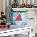 Close-up of LED light-up Christmas gnome pillowcase on a festive white table setting - Beard Style