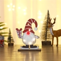 Detail of wooden Christmas gnome with LED lights, striped hat and skates on a wooden base - Red Striped Hat Style