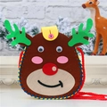 Detail of DIY Christmas reindeer felt bag showing handmade stitching and festive textures - Deer