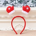 Detailed view of red Christmas headband with snowy gloves on festive background - Gloves