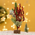 Mini Christmas tree with red berries, pine needles and log base on snowy background - Blue Flower