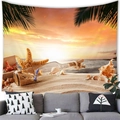 Detail of beach sunset tapestry hanging above a grey sofa with shells and palm leaves - Peach Skin / 150cmx100cm / Warm Sunset Starfish Style (1)