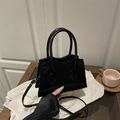 Chic black shearling tote bag with leather trim and shoulder strap for autumn winter style - Black