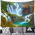 Modern wall tapestry featuring a lush waterfall landscape over a gray fabric sofa - 11