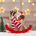 Detail of wooden Christmas rocking horse ornament with Santa riding a reindeer - Large Santa Claus