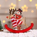Macro view of a wooden snowman riding a reindeer ornament with a red knit scarf - Large Snowman