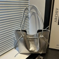 Silver metallic tote bag with drawstring knots and wavy edges for women's fashion - Silver