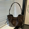 Dark brown glossy PU leather tote bag with side drawstring details and thin shoulder straps - Brown