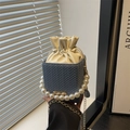 Blue woven bucket bag with pearl handle and drawstring lining for stylish women - Blue