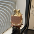 Pink woven bucket bag with elegant pearl handle and gold chain strap for women - Pink