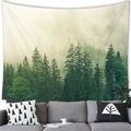 Lush green forest landscape tapestry hanging over a gray sofa as home wall decoration - 14