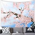 Pink cherry blossom tree wall tapestry for home decor above a modern sofa - Medium Peach Skin Fabric / Sakura Blue Sky