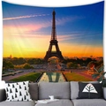 Detail view of Eiffel Tower tapestry hanging above a grey sofa in a cozy living room setup - 10 / 100x70(Peach Skin)