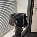 Fashionable black sequin dumplings bag with gold chain strap for shoulder or crossbody use - Black