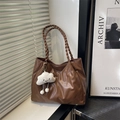 Deep brown pleated tote bag with woven handles and white cloud plush charm in minimalist style - With Pendant / Brown