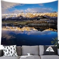 Detailed view of scenery tapestry above modern sofa showing mountain and lake reflections - Snowy Mountain Cabin (12)