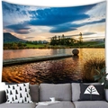 Wall hanging tapestry with a sunset lake and mountain landscape over a gray sofa - Lakeside Dock (14)