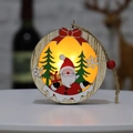 Lighted wooden Christmas ornament featuring Santa Claus and green trees with a red bow - Round Santa