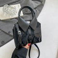 Unique black shirt-shaped handbag with glossy pleated texture and adjustable strap - Black