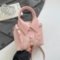 Pink shirt-shaped handbag with button details and textured faux leather finish - Pink