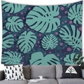 Detail of tropical monstera leaf tapestry hanging over a gray sofa in a modern room - 150x100(Peach Skin) / Monstera Polka Dot Navy (1)