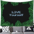 Tapisserie feuilles de monstera avec texte 'LOVE YOURSELF' suspendue sur mur gris - 100X70 / Fond Noir LOVE YOURSELF (18)