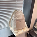 Waterproof cream nylon multi-purpose backpack with front zipper pocket on window sill - Beige
