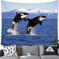 Detailed close-up of a high-resolution whale tapestry hanging above a modern sofa - 100x70(Peach Skin) / Orcas and Snow Mountains (7)