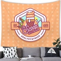 Detailed close-up of retro ice cream tapestry hanging over a sofa for wall decor - 100X70 / Vintage Orange Ice Cream Logo