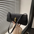 Minimalist black pebbled leather underarm bag with elegant golden U-shaped metal buckle - Black