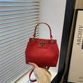 Red lychee pattern leather shoulder bag with gold metal lock and elegant top handle - Red