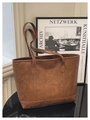 Detail of vintage brown leather tote bag showing Creative Case branding and wide bottom base - Brown