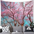 Tapiz de pared con cerezo en flor rosa colgado sobre un sofá gris decorativo - 150x100cm / Avenida de cerezos