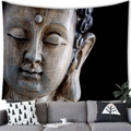 Detail of a large Buddha wall tapestry showing textured stone effect over a modern sofa - Style 8