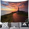 Lighthouse tapestry hanging above a grey sofa creating a warm coastal home atmosphere - 150x100cm / Realistic Road Lighthouse (Peach Skin)