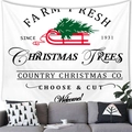 Detail of Christmas wall tapestry featuring a red sleigh and tree over a grey sofa - Country Christmas Red Sleigh (9)