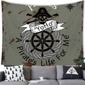 Detail of pirate anchor skull tapestry on a modern living room wall with a grey sofa - A Pirate's Life Skull Style