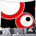 Dettaglio di un arazzo geometrico rotondo appeso sopra un divano moderno - 100x70cm / Punti Pop alla Moda